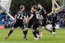 Kyle Dempsey celebrates his goal against Peterborough United