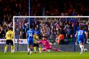 Cameron Brannagan scores from the penalty spot at Peterborough in the semi-final
