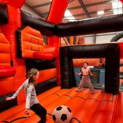 An inflatable football pitch has been installed