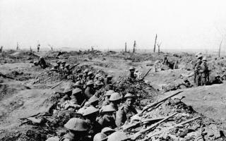 Undated file photo of British infantrymen occupying a shallow trench in a ruined landscape before an advance during the Battle of the Somme. Candle-lit vigils could be held at churches and buildings across the country to mark next year's Great War