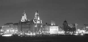 A photograph from the Bolton Digital Summer Print Exhibition shows the famous ferry across the Mersey. This view of the Liverpool skyline, taken by Michael Aspinall, shows the city’s impressive Liver Building in all its glory.