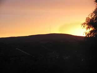 WINTER Hill in all its brooding glory, bathed in fading sunlight at the end of a late summer’s day.
This image was captured by Barbara Worthington who took the picture over the neighbouring rooftops from her home in Harwood.