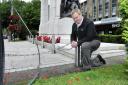 Cllr Christopher Peacock at the war memorial in Victoria Square, where his grandmother's poppy wreath was stolen