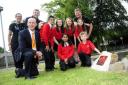 Headteacher Alec Cottrill with teachers, from the left, Malini Craig, Andrew Scholefield and Stuart Pearson. Youngsters from the left top are Ansar Lala, Kia Stones, Emily Affleck and Isobella Saunders. Front, from the left are Jyotika Bhojani and