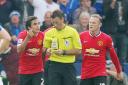 Manchester United's Wayne Rooney and Rafael remonstrate with referee Mark Clattenburg in their defeat at Leicester this season
