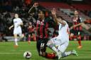 Dorian Dervite brings down Bournemouth's Callum Wilson to earn a red card on Monday