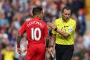 UNWANTED CARD: Philippe Coutinho has words with referee Kevin Friend after being shown a red card during the Premier League match between Liverpool and West Ham United recently