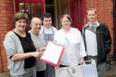 PETITION: Nearly 300 people have signed the Bolton Steps petition. From left are Ruth Haigh, Manager, Mick Ross-Nichol, volunteer, Lee Carolan, volunteer, Glenys Riley, chef and Jordan Hacking, student.