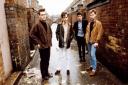 ICONS: The Smiths in one of their trademark Manchester back street poses