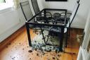 SHATTERED: Mo and Steph Johnson returned home to find their dining room table had 'exploded'