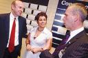 TALKING SHOP: Local Government Minister John Healey, left, at The Work Shop in Newport Street, Bolton, with Suzanne Smart, who was helped to find a job by staff at the centre, and work placement officer Mark Slater