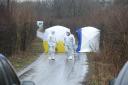 TRAGIC SCENE Forensic officers at the site in Ox Hey Lane where the baby’s body was found