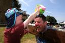 Alan Scollan gets a drenching in the stocks from son Sean, five, at The View's first anniversary
