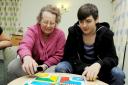Playing Ludo are Jean Pederson and Ethan Brown, aged 16