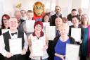 Dramatic Action members with their certificates and Lofty the Lion