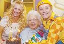 <li>Great-grandmother Muriel Owen at the Motorcise gym in Bolton town centre where she regularly enjoys a workout <li>  Muriel receives a birthday cake from manager Ann Wood, left, and trainer Francis Farrell