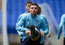 Aaron Morley goes through a warm-up at Bolton Wanderers