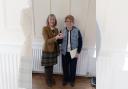 Inner Wheel Club of Horwich President Katie Maher presenting Eileen Dickinson with her tumbler
