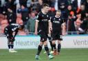 Bolton Wanderers players look dejected after Jordan Lawrence-Gabriel scored Blackpool's fourth goal Picture: CameraSport