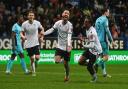 Josh Sheehan celebrates Bolton Wanderers' fifth goal on the night against Oxford United