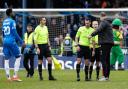Ian Evatt speaks to the match officials at the end of Saturday's 3-3 draw at Peterborough United