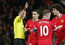 Referee Michael Oliver sends off Manchester United's Angel Di Maria on Monday night
