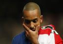 Theo Walcott looks dejected after Arsenal exited the Champions League - but should we sympathise with plucky losers?