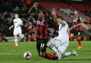 Dorian Dervite brings down Bournemouth's Callum Wilson to earn a red card on Monday