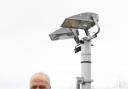 Ladybridge chairman Steve Hill with the club's new floodlights