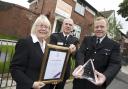 Cllr Elaine Sherrington, Bolton Fire Station Commander Brian Wiggans and Chief Supt Dave Lea of Bolton Police with the award