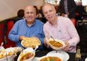 Luis Troyano with Mike Harrison try the Bolti at the Royal Balti House