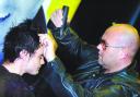 TRIM: Top international hairstylist Simon Shaw cuts student Chris McWilliam’s hair during a show at Bolton Community College
