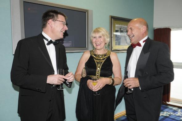 ENJOYING A JOKE: Sean Harriss, Bolton Council chief executive, with Tony Taylor, of sponsors Groundwork, and his wife, Jill