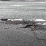 Potholes like this are an all-too familiar sight across Bolton