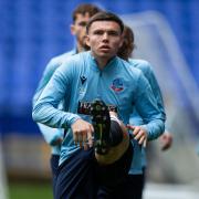 Aaron Morley goes through a warm-up at Bolton Wanderers