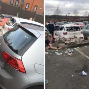Three cars damaged after van backs into wall then drives off