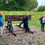 Mayor of Horwich, Cllr David Grant, accompanied by Horwich
Heritage Chairman, Stuart Whittle, cutting the ribbon to unveil the restored Buffers
in Old Station Park, Horwich