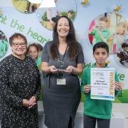Beaumont Primary School, Ladybridge, winner of School of the Year. Pictured L-R: Chair of Governors Susan Leach, Headteacher Stacey Postle and Headteacher Prefect Uzair Mohamed.