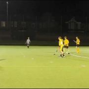 Action from the men's thirds' clash