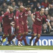 Wanderers players celebrate Nicolas Anelka's goal at Manchester City