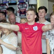 Bolton fans dejected as Suarez sinks England