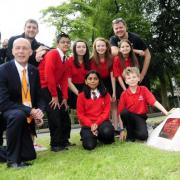 Headteacher Alec Cottrill with teachers, from the left, Malini Craig, Andrew Scholefield and Stuart Pearson. Youngsters from the left top are Ansar Lala, Kia Stones, Emily Affleck and Isobella Saunders. Front, from the left are Jyotika Bhojani and