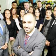 Chief executive Imram Akram, centre, with staff at Asons Solicitors