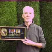 Joe Dunn with his grandfather's medals