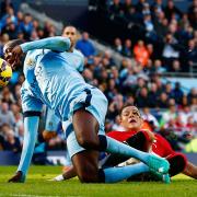 Marcos Rojo tackles Yaya Toure in the box during Sunday's Manchester derby