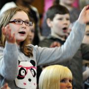 ON SONG: Youngsters at Sing Day at Victoria Hall