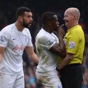 QPR's Nedum Onuoha and Steven Caulker remonstrate with Bolton referee Lee Mason during their defeat at Crystal Palace on Saturday