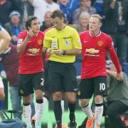 Manchester United's Wayne Rooney and Rafael remonstrate with referee Mark Clattenburg in their defeat at Leicester this season
