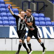 GOAL-DEN: Colls players celebrate another strike