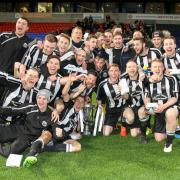 Atherton Collieries celebrate their Hospital Cup success at the Macron Stadium